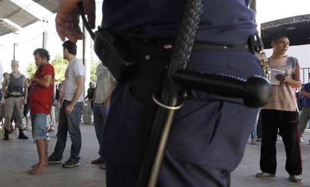 Inmates of the Tacumbu maximum security prison line up to be interviewed by judges and district attorneys from the Justice Ministry during a biannual visit to verify the status of the cases of prisoners accused of crimes but whose trials are delayed, in Asuncion. (REUTERS)