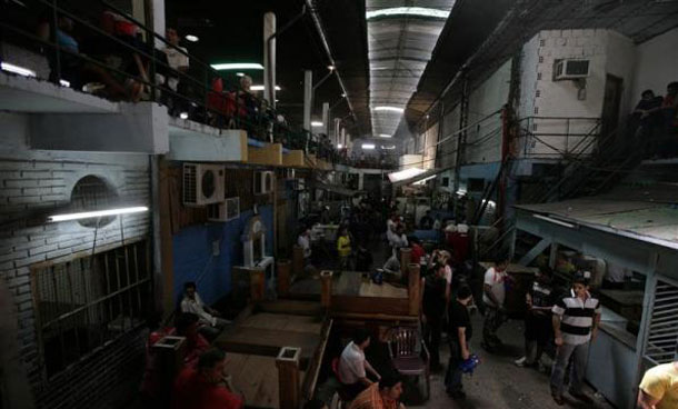 A view of inmates inside Tacumbu high security prison in Asuncion. Paraguay's President Fernando Lugo ordered the closing of Tacumbu, the largest prison in the country, because it is populated beyond its capacity and living conditions are precarious. The transfer of the inmates should begin in 2011. (REUTERS)