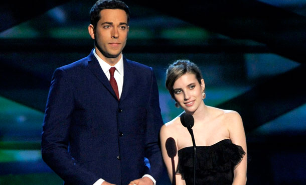 Zachary Levi, left, and Emma Roberts are seen on stage at the People's Choice Awards, in Los Angeles. (AP)