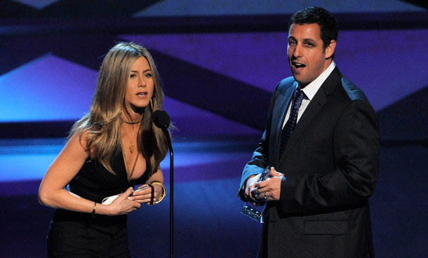 Jennifer Aniston, left, announces Adam Sandler as winner for favorite comedic star at the People's Choice Awards in Los Angeles. (AP)