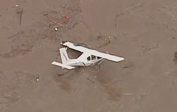 A plane is seen in floodwaters in Grantham, a township between Toowoomba and Brisbane, in this still image taken from video. (REUTERS)