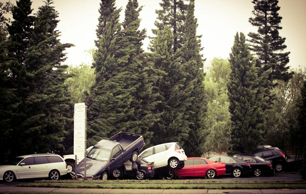 Overturned and piled up cars are seen in central Toowoomba between 15:00 and 17:00 hours AEST following a flash flood which ripped through the town centre. (GETTY)