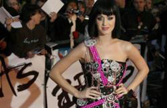 Katy Perry poses for photographers as she arrives for the Brit Awards at Earls Court in London. (REUTERS)