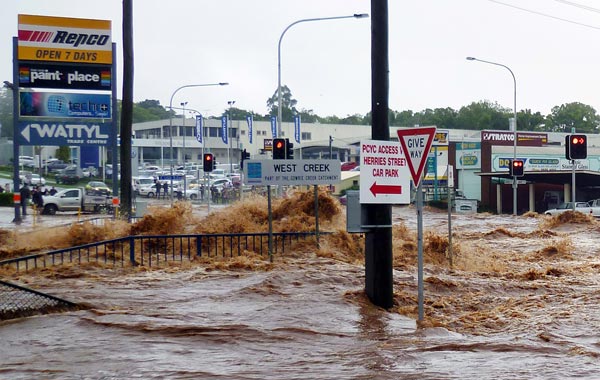 Australia braced for a rapidly rising death toll on January 11 after flash floods killed eight and left 72 missing, as a quickly spreading flood disaster forced evacuations in central Brisbane. (AFP)