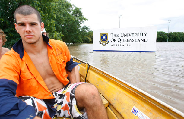 A sign is seen in the flooded grounds of The University of Queensland in the Brisbane suburb of Saint Lucia. Flood water in Australia's third-biggest city peaked below feared catastrophic levels on Thursday but Brisbane and other devastated regions faced years of rebuilding and even the threat of fresh floods in the weeks ahead. (REUTERS)