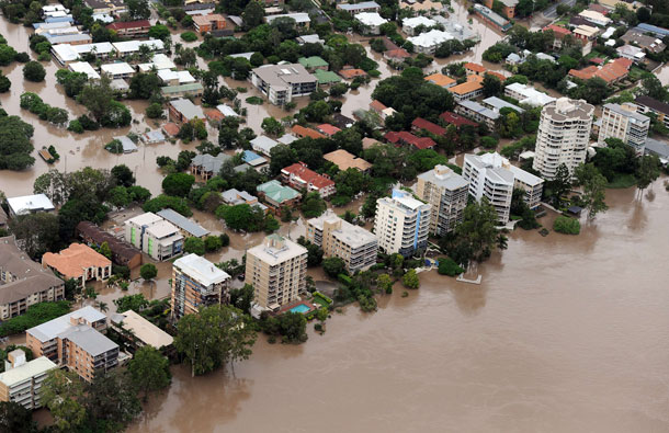 This aerial image shows luxury apartment blocks rising out of the murky waters of the Brisbane River as flood waters devastate much of Brisbane. Australia's third-largest city Brisbane was turned into a "war zone" with whole suburbs under water and infrastructure smashed as the worst flood in decades hit 30,000 properties. (AFP)