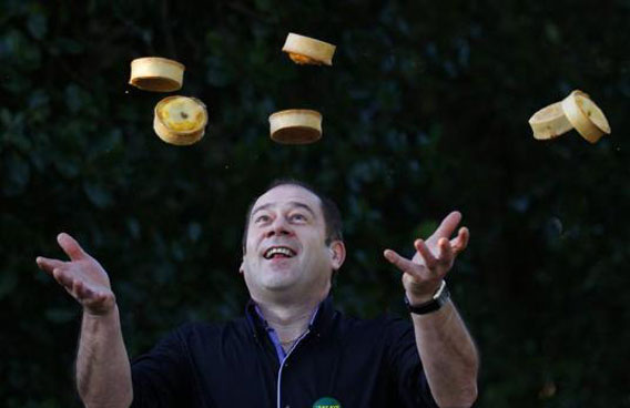 Maurice Irvine looks up at some of his pies during a photocall, after being named World Scotch Pie Champion, in Dunfermline, Scotland. The competition, now in its twelfth year, received four hundred different kinds of pies from over fifty butchers and bakers. (REUTERS)