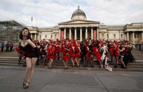 Burlesque enthusiasts and staff of a holiday travel firm pose in costume for photographers outside the National Gallery at Trafalgar Square in London. The stunt was organised by Virgin Holidays in an attempt to break the world record for the world's largest burlesque dance. (REUTERS)