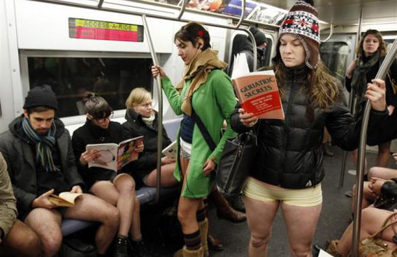 People take part in the 10th Annual No Pants Subway Ride in New York City. The event, organised by Improv Everywhere, involves participants who strip down to their underwear as they go about their normal routine. (REUTERS)