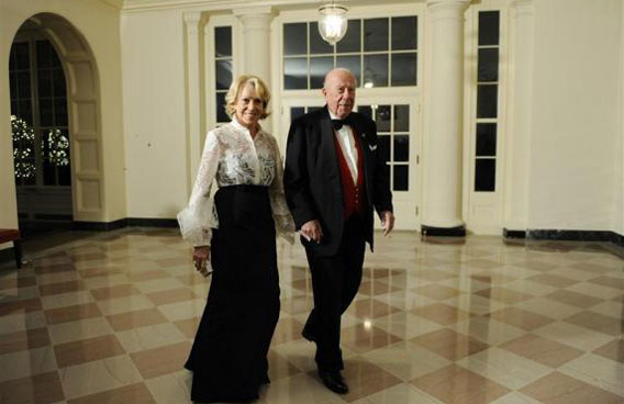 Former Secretary of State George Shultz arrives with his wife Charlotte for the state dinner hosted by President Obama and first lady Michelle for President of China Hu Jintao at the White House. (REUTERS)