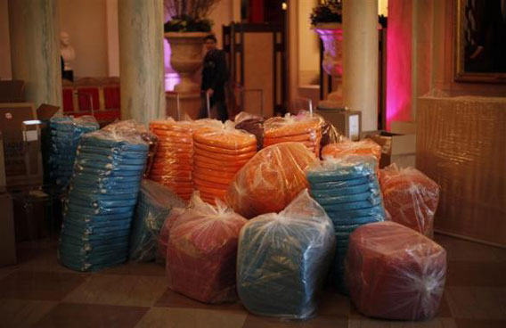 Multicoloured seat cushions wait to be matched to clear plastic chairs on the state floor of the White House during preparations for the state dinner hosted by President Obama for Chinese President Hu Jintao at the White House. (REUTERS)