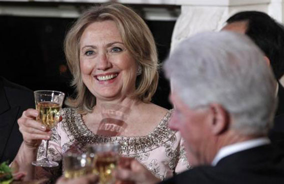 Secretary of State Hillary Clinton and her husband former President Bill Clinton attend a State Dinner in honor of President of China Hu Jintao at the White House. (REUTERS)