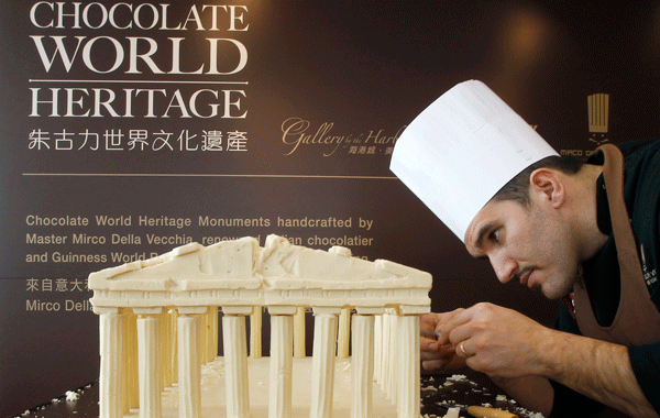 Italian chocolatier Mirco Della Vecchia makes a chocolate sculpture of the Parthenon as part of his "Chocolate World Heritage" exhibition in Hong Kong. (REUTERS)