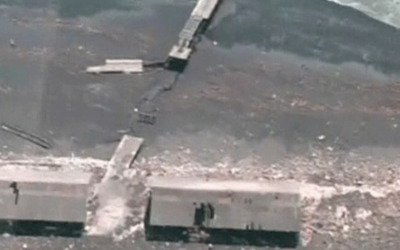 A bridge was destroyed during a massive earthquake in the coastal town of Dichato, Chile. One of the world's most powerful earthquakes in a century pounded Chile on Saturday, killing more than 300 people as it toppled buildings and triggered tsunamis that ravaged a port town and threatened Pacific coastlines as far away as Japan (REUTER)