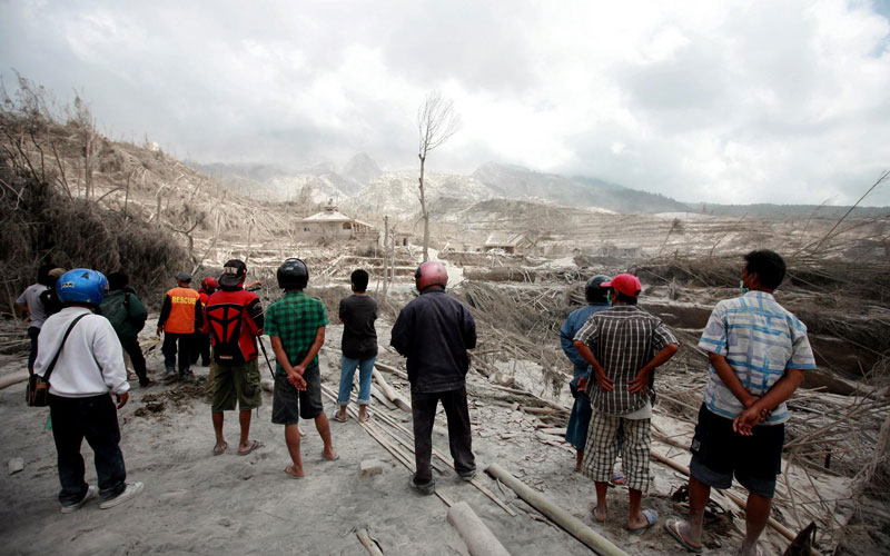 Residents look at the remains of their village in Kinaredjo, Sleman, Indonesia, on Wednesday, a day after Mount Merapi erupted. (EPA)

2010 was one of the worst years on record for natural disasters over the past two decades, leaving nearly 297,000 people dead, research for the United Nations showed on Monday. 

The devastating earthquake in Haiti a year ago accounted for about two thirds of the toll, killing more than 222,500 people, according to the Belgium-based Centre for Research on the Epidemiology of Disasters (CRED).

The CRED found that the summer heatwave in Russia was the second deadliest disaster of the year, leaving 55,736 people dead according to figures it compiled from insurers and media reports of official sources.

The year was "one of the worst in decades in terms of the number of people killed and in terms of economic losses," Margareta Wahlstroem, UN special representative for disaster risk reduction, told journalists.

"These figures are bad, but could be seen as benign in years to come," she said, pointing to the impact of unplanned growth of urban areas, environmental degradation and climate change.

The economic cost of the 373 major disasters recorded in 2010 reached 109 billion dollars, headed by an estimated 30 billion dollars in damage caused by the powerful earthquake that struck Chile in February.

The earthquake unleashed a tsunami that swept away villages and claimed most of the 521 dead.
Summer floods and landslides in China caused an estimated 18 billion dollars in damage, while floods in Pakistan cost 9.5 billion dollars, according to the CRED's annual study.

Although impoverished Haiti is still struggling to recover from the quake that devastated much of the capital, Port-au-Prince, it ranked lower down the global economic scale with an estimated eight billion dollars in losses.

Asians accounted for 89 percent of the 207 million people affected by disasters worldwide last year, the CRED said.