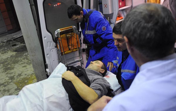 Medics wheel a victim of a bomb explosion at Domodedovo airport from an emergency vehicle into the N.V. Sklifosovsky Scientific Research Institute of First Aid in Moscow. (REUTERS)