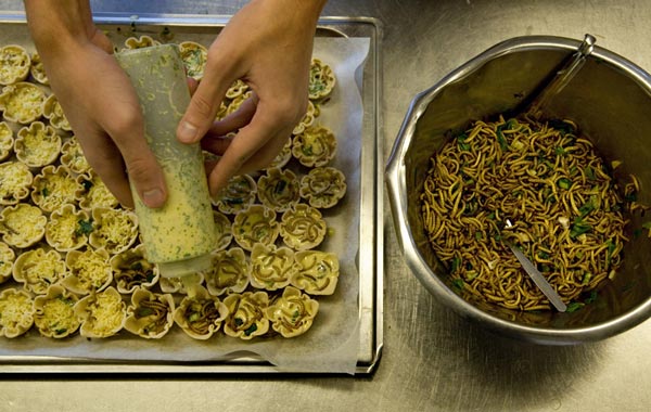 A student prepares mealworm quiches at the Rijn IJssel school for Chefs in Wageningen January 12, 2011. To try and get wider support for their attempts to introduce insects on the menu of the top restaurants, scientists at the Wageningen University teamed up with the local cook academy.
Quiche with mealworms, springrolls with roasted grasshoppers and chocolate pralines with buffalo worms do not make ideal menu for housewarming parties, but in a few decades could be on dinner tables in many European countries as scientists seek ways to replace expensive meat. (REUTERS)