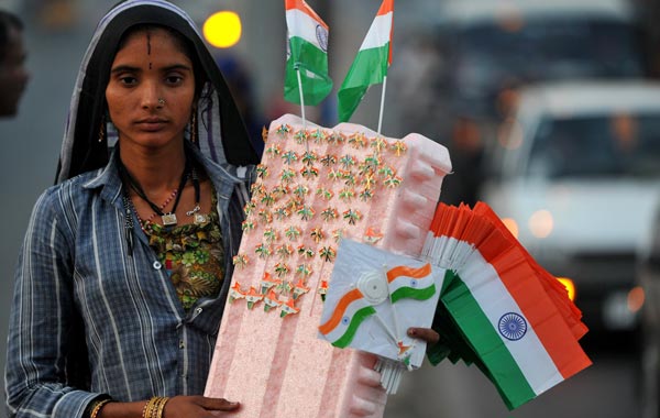 An Indian street vendor sells national tricolour flags in the streets of Hyderabad. (AFP)