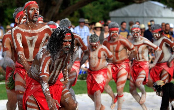 Aboriginal men perform part of the Woggan-ma-gule ceremony with their contemporary interpretation of a creation story from the Yuin people during Australia Day celebrations in Sydney. (AP)