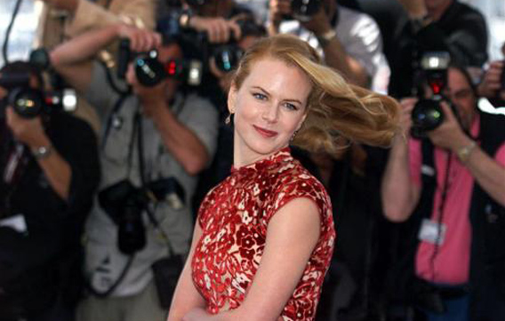 Australian actress Nicole Kidman strikes a pose in front of a wall of photographers during a photo call for the film "Moulin Rouge" at the 54th International Film Festival in Cannes. (REUTERS)