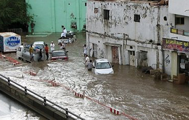 People are stranded in a flooded area in the Saudi Red Sea city of Jeddah. (AFP)