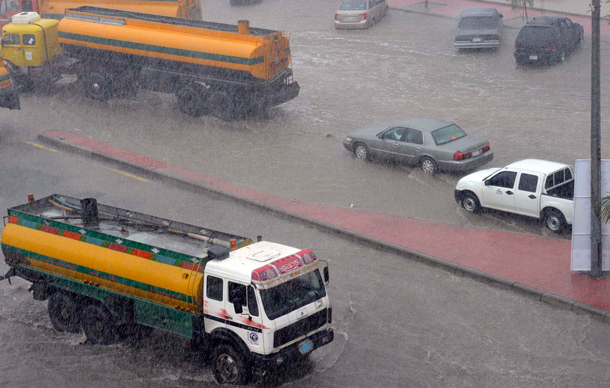 Motorists drive vehicles amid heavy rainfall in Jeddah. Torrential rainfall submerged streets and cut off electricity in parts of Saudi Arabia's second largest city Jeddah on Wednesday, raising fears of a repeat of floods in 2009 which killed more than 120 people. (REUTERS)