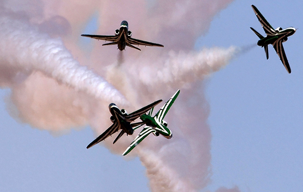 The Royal Saudi Hawks, the aerobatic team of the Royal Saudi Air Force, perform during the Al-Ain International Aerobatics Show at the Gulf emirate's airport. (AFP)