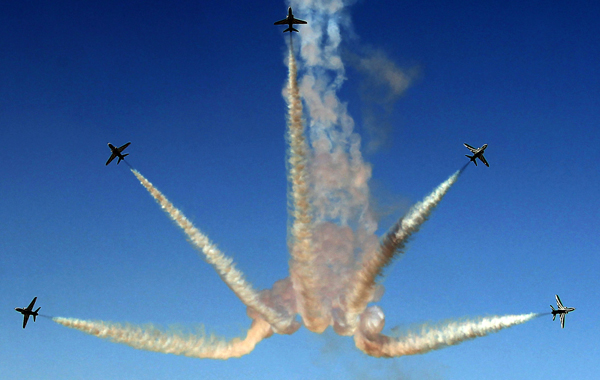 The Royal Saudi Hawks, the aerobatic team of the Royal Saudi Air Force, perform during the Al-Ain International Aerobatics Show at the Gulf emirate's airport. (AFP)