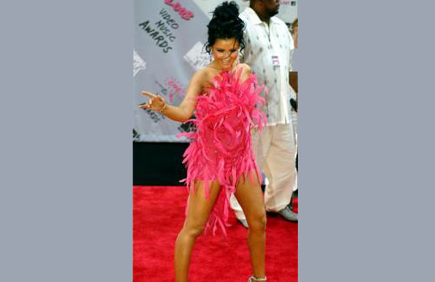 Pop start Christina Aguilera poses for photographers as she arrives at the 2003 MTV Video Music Awards at the Radio City Music Hall in New York. (REUTERS)