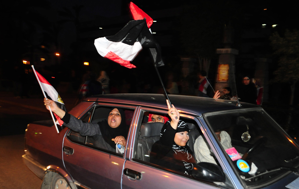 Egyptian anti-government protesters celebrate in the coastal city of Alexandria on February 11, 2011 after president Hosni Mubarak stepped down and handed power to the military. (AFP)