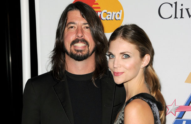 Musician Dave Grohl (L) and Jordyn Blum Grohl pose at the 2011 Pre-GRAMMY Gala and Salute To Industry Icons Honoring David Geffen at Beverly Hilton in Beverly Hills, California. (AFP)