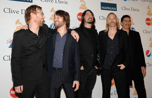 From left, Musicians Nate Mendel, Chris Shiflett, Dave Grohl, Taylor Hawkins and Pat Smear, of the Foo Fighters, arrives at the Pre-Grammy Gala & Salute to Industry Icons with Clive Davis honoring David Geffen in Beverly Hills, Calif. (AP)