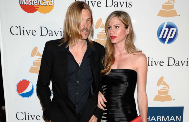 Taylor Hawkins and guest arrive at the Pre-Grammy Gala & Salute to Industry Icons with Clive Davis honoring David Geffen in Beverly Hills, Calif. (AP)