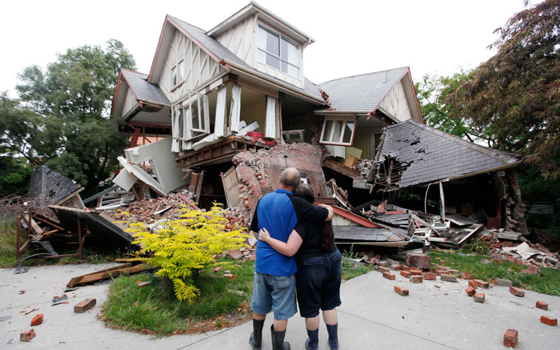 Murray and Kelly James look at their destroyed house in central Christchurch, New Zealand, Wednesday, Feb. 23, 2011. Tuesday's magnitude-6.3 temblor collapsed buildings, caused extensive other damage and killed dozens of people in the city. (AP)