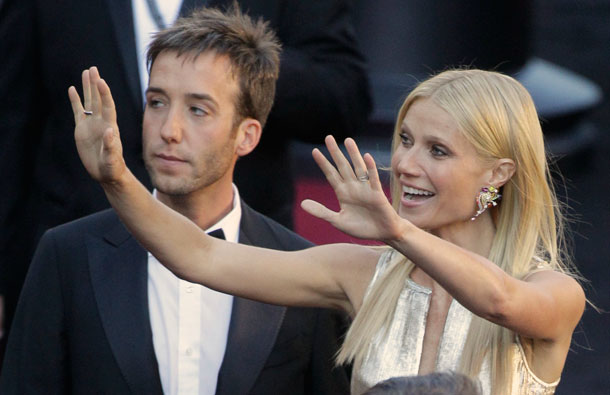 Actress Gwyneth Paltrow, right, waves to fans as she arrives before the 83rd Academy Awards on Sunday, in the Hollywood section of Los Angeles. (AP)