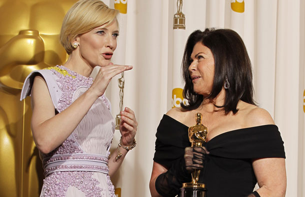 Colleen Atwood holds her Oscar for achievement in costume design won for "Alice in Wonderland" as she speaks with presenter Cate Blanchett (L) backstage at the 83rd Academy Awards in Hollywood, California. (REUTERS)