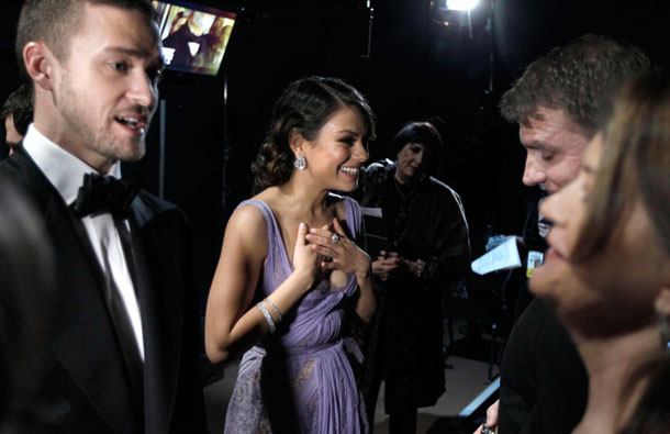 Justin Timberlake, left, and Mila Kunis are seen backstage at the 83rd Academy Awards on Sunday, in the Hollywood section of Los Angeles. (AP)