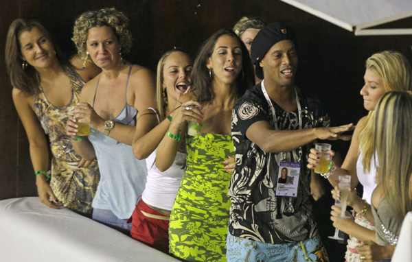 Brazilian soccer star Ronaldinho dances during the carnival parade at the Sambadrome in Rio de Janeiro, Brazil. (AP)