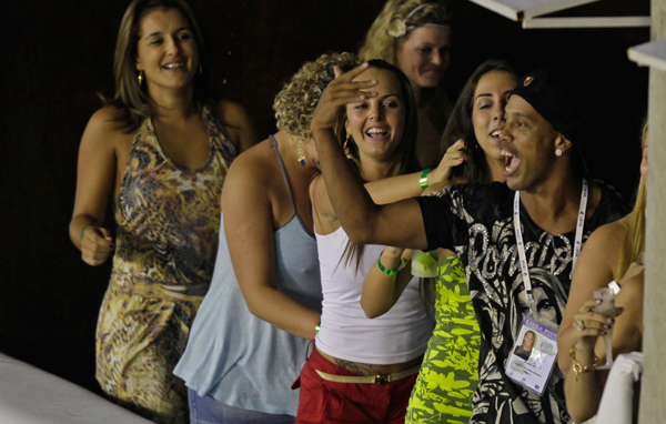 Brazilian soccer star Ronaldinho dances during the carnival parade at the Sambadrome in Rio de Janeiro, Brazil. (AP)