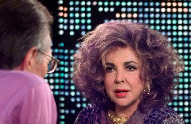 Elizabeth Taylor, Academy Award winning actress, shows the Krupps Diamond she is wearing to talk show host Larry King as she is interviewed on the CNN program Larry King Live, in this January 15, 2001 file photograph at the CNN studios in Los Angeles. Taylor died on March 23, 2011 at age 79, her publicist said. She died at Cedars-Sinai Hospital in Los Angeles surrounded by her four children after having been hospitalized six weeks ago with congestive heart failure, a statement from publicist Sally Morrison said. (REUTERS)