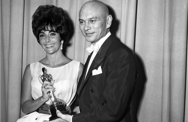 Actress Elizabeth Taylor poses with her best actress Oscar for her role in "Butterfield 8" with actor Yul Brenner at the 33rd Academy Awards held in Santa Monica, California in this April 17, 1961 publicity photo from the Academy of Motion Picture Arts and Sciences released to Reuters March 23, 2011. Taylor, a two-time Oscar winner and Hollywood beauty whose screen success was sometimes overshadowed by her tumultuous personal life, died of congestive heart failure on Wednesday at age 79. (REUTERS)