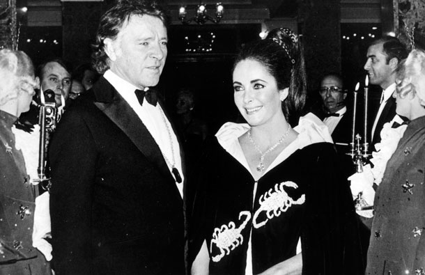 Nov. 15, 1969 file photo shows Richard Burton and Elizabeth Taylor as they arrive at Hotel Hermitage for the Scorpion-Ball in Monaco.  Princess Grace of Monaco invited the couple along with other guests for the celebration of her 40th birthday.  Taylor is wearing the 69-carat diamond which is now known as the Taylor-Burton Diamond. Taylor died Wednesday at age 79 of congestive heart failure. (AP)