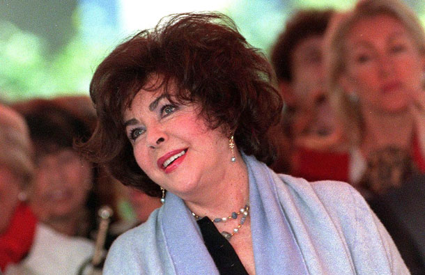 US actress Elizabeth Taylor attends the unveiling of a star for her friend songwriter Carole Bayer Sager on the Hollywood Walk of Fame 14 February, 2000, in Hollywood, California. Taylor, famed for her striking blue eyes and eight marriages as well a glittering film career, has died at the age of 79, a statement by her publicist said March 23, 2011. (AFP)