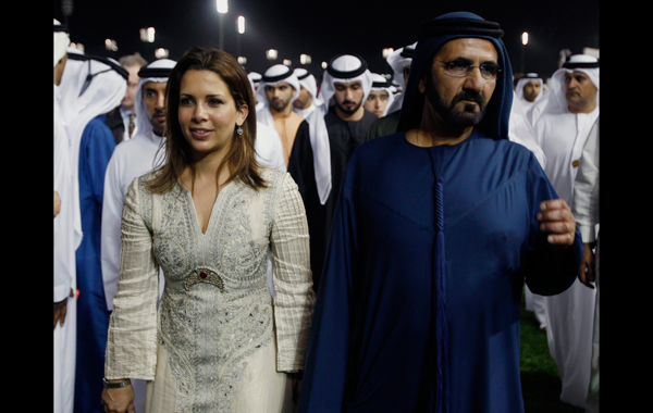 Vice President and Prime Minister of the UAE and Dubai's ruler, His Highness Sheikh Mohammed bin Rashid Al Maktoum walks with his wife Princess Haya bint Hussein after the eighth and final race of the 16th Dubai World Cup at the Meydan Racecourse in Dubai. (AP)