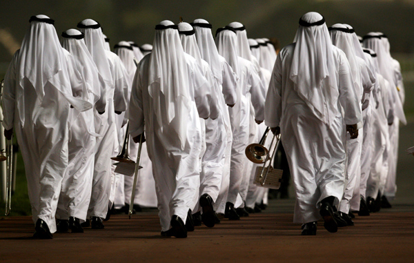 Cadets from the Dubai Police Academy walk after performing the national anthem during a presentation at the 16th Dubai World Cup at Meydan Racecourse in Dubai. (REUTERS)