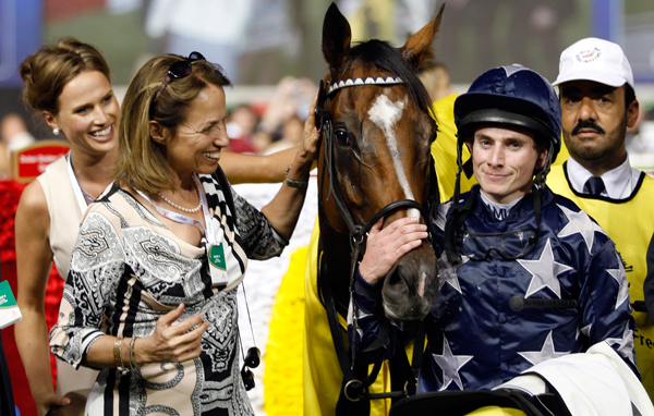 Ryan Moore, riding Presvis of Britain, celebrates after winning the sixth race of the 16th Dubai World Cup at the Meydan Racecourse in Dubai. (REUTERS)