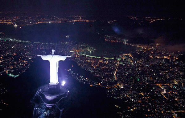 An aerial view of the iconic Christ the Redeemer statue before the lights that illuminate the statue are switched off to observe an hour of voluntary darkness for the global "Earth Hour" campaign, in Rio de Janeiro, Brazil. (AP)