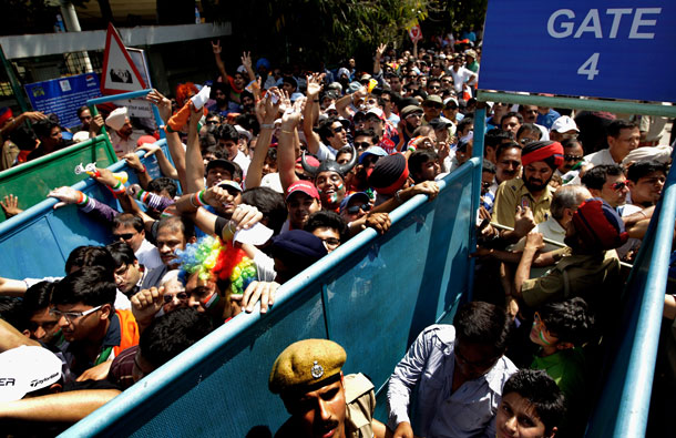 Indian security personnel try to control spectators prior to passing through a metal race for security screening prior to the start of the 2011 ICC World Cup second Semi-Final between India and Pakistan at Punjab Cricket Association (PCA) Stadium on March 30, 2011 in Mohali, India. (GETTY/GALLO)