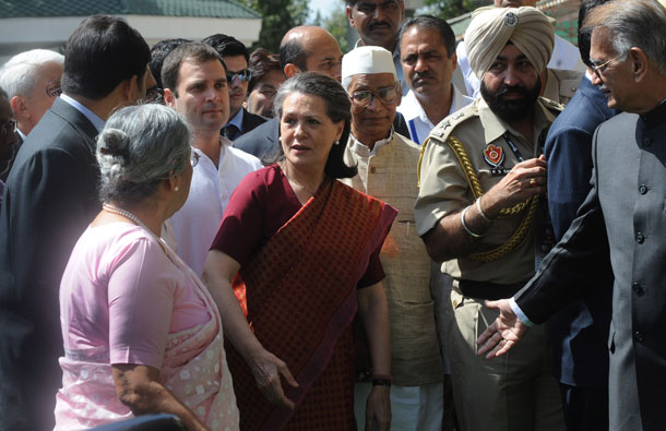 Chairperson of India's UPA government Sonia Gandhi (C) and her son Congress Party General secretary Rahul Gandhi (C/L) walk with officials as they arrive to attend the 2011 ICC World Cup second Semi-Final between India and Pakistan at Punjab Cricket Association (PCA) Stadium on March 30, 2011 in Mohali, India. (GETTY/GALLO)