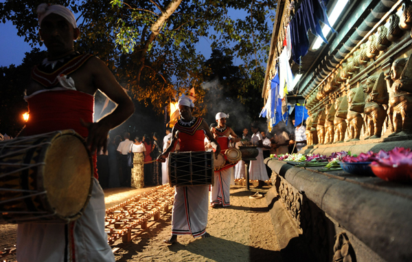 Sri Lankan Kandyan dancers perform during the special prayers to bless the national cricket team at the Kelaniya Temple in Kelaniya. Sri Lanka plays India in the final match of the ICC Cricket World Cup tournament in Mumbai. (AFP)